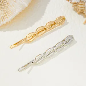 Gold and silver seashell hair clips detail shot, beach ocean style metal bobby pins for women