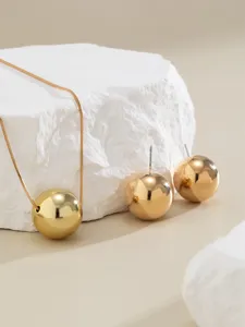 Minimalist gold tone snake chain necklace and round ball stud earrings set for women.