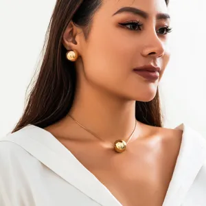 Minimalist gold ball pendant necklace and matching earrings set for women, elegant jewelry.
