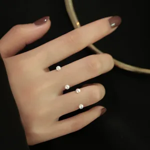 Detail shot of exquisite multi-layer open pearl ring, elegant finger jewelry design for women.