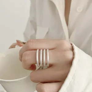 Minimalist multi-layer silver color open ring for women, chic textured metal finger jewelry.
