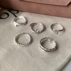 Set of 5 minimalist silver rings, stylish open adjustable finger rings for daily wear.