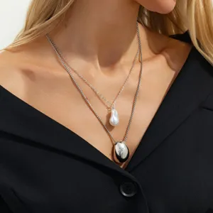 Elegant double layer necklace featuring a pearl pendant and metal drop for women fashion wear.