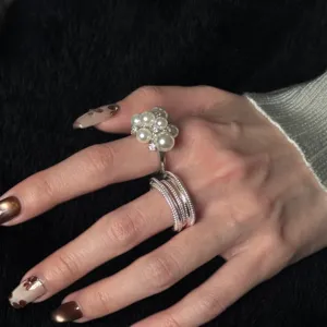 Sweet imitation pearl ring and multi-layer open ring elegant jewelry detail shot
