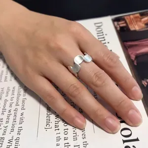 Minimalist geometric brushed silver ring with irregular linked circles for women fashion.