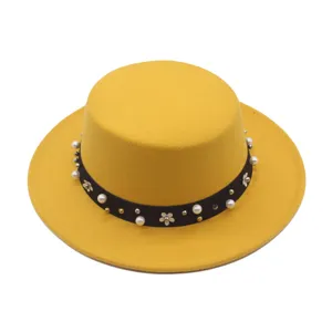 Stunning yellow flat top hat with pearl band, elegant women autumn wool fedora hat detail.
