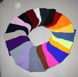 Colorful knit beanies in a circular color wheel display, soft and warm winter skull cap.