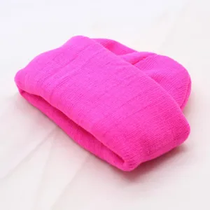 Fluorescent pink solid color knit beanie detail view, warm winter cozy woolen cap.