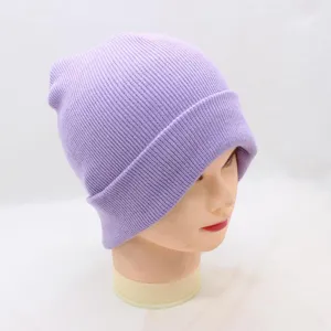 Close-up view of a soft light purple ribbed knitted beanie showing fine fabric texture and cuff detail.