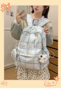 Korean style plaid backpack for women school cute bag with plush pendant and side pocket.