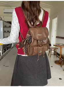 Vintage brown PU leather backpack for women, retro casual rucksack with multi pockets.