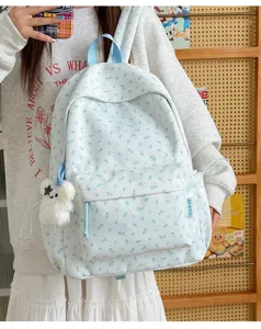 Light blue floral fabric backpack, sweet style student travel dual-use daily casual bag.