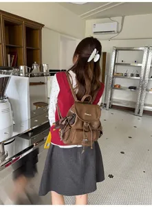 American retro women's brown leather backpack, stylish college style commuting school bag.