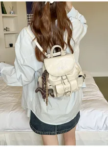 Vintage PU leather backpack for women, retro college style school bag with horse charm.
