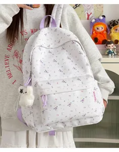 Sweet floral backpack for women and students, cute small school bag with bows and pendants.