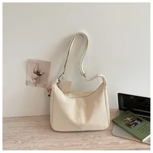 Detailed view of chic casual PU leather shoulder bag with clean stitching and soft cream color.