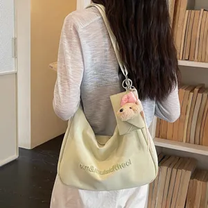 Green shoulder bag for women, soft aesthetic hobo bag with cute bear pendant and card holder.