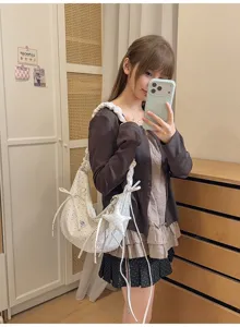 Sweet polka dot shoulder bag with bows and star pendant, trendy hobo bag for women daily wear.