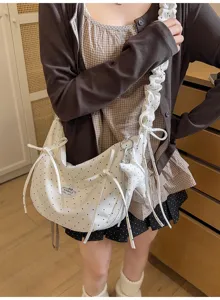 White polka dot crossbody bag with cute bows and star pendant for sweet girls daily use.