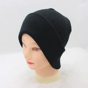 Close-up view of the black knit beanie, showing the fine ribbed texture and clean stitching details.