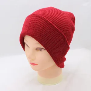 Classic red knit beanie hat detail view, warm winter wool cap for daily casual wear.