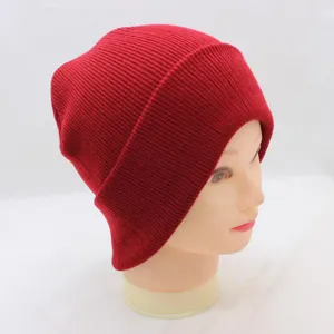 Detailed view of a classic red knit beanie hat, showing fine ribbed texture and clean stitching.