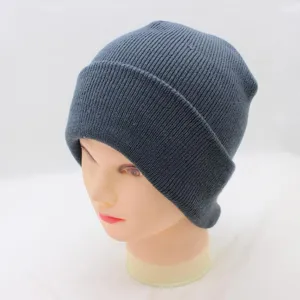Dark grey knitted beanie detail, ribbed cuff design texture close up winter wear