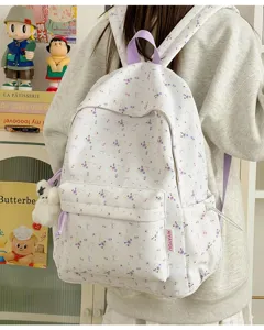 Sweet floral backpack for women and students, casual cute school bag with bow print.