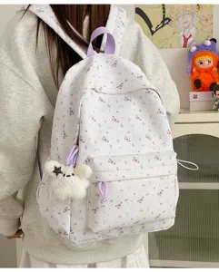 Cute floral print canvas backpack with cute plush charm for school and daily casual travel use