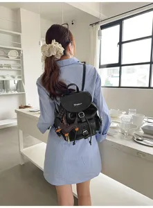 Vintage black backpack for women, retro college style commuter bag, chic daily school bag.