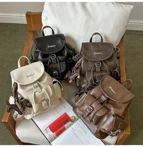 Vintage style multi-color PU leather backpacks arranged on a cozy chair with a recipe magazine.