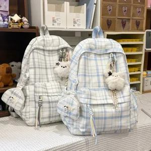 Korean style plaid backpack for students, lightweight school bag with cute plush pendant and pouch.
