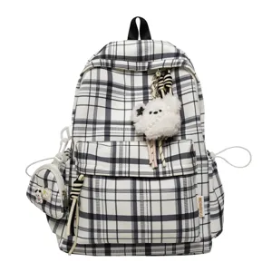 Korean black and white plaid backpack for women, lightweight school bag with plush pendant.