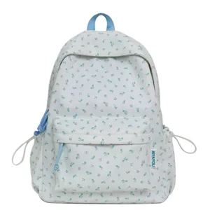 Cute ditsy floral fabric backpack for women and students, casual daily school travel bag.