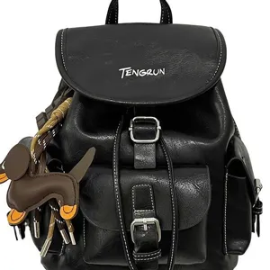American retro style women's black leather backpack with cute puppy charm and metal buckles.