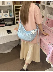Light blue polka dot hobo shoulder bag with bow ties and cute star pendant for sweet girls.