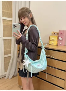 Cute polka dot pleated hobo shoulder bag with bow and star pendant for women and girls.