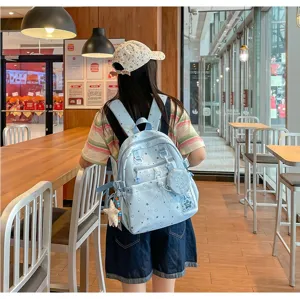 Light blue star pattern casual travel backpack with cute round coin pouch for daily school use.