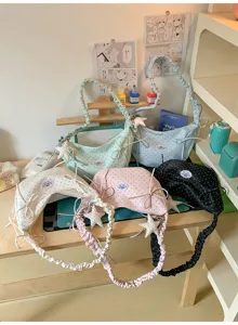 Polka dot hobo shoulder bag with ruffled strap and bow, cute sweet girl style daily carry.