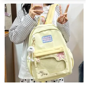 Milk yellow casual student school backpack with cute bow and clear window design for daily use.