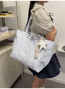 Casual light blue star print tote bag for women daily commute shoulder bag with star pendant.