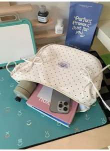 Polka dot canvas shoulder bag with cute side bows, sweet style crossbody bag for daily casual use.
