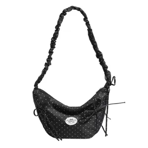 Black polka dot hobo shoulder bag with scrunchie strap and cute side bows for daily fashion.