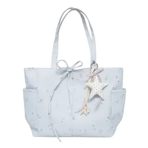 Women commuter star print tote bag versatile shoulder handbag with cute star pendant.