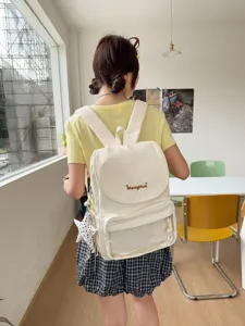 Casual daily canvas backpack with clear front pocket and cute star charm detail for women
