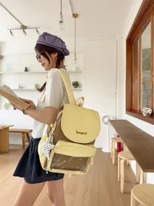 Sweet girlish yellow brown backpack with clear front pocket and star pendant for daily use.