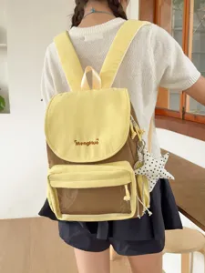Detail shot of the sweet contrast color backpack with clear front pocket and star pendant.