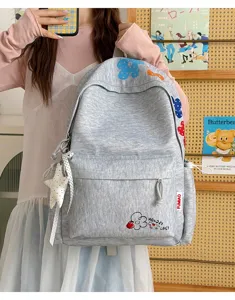 Casual grey canvas backpack with cute floral embroidery, lightweight daily school bookbag for girls.