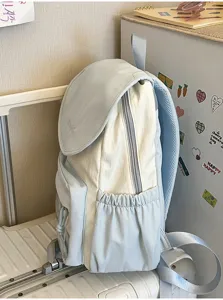 Light blue canvas casual backpack for daily school and travel. Stylish soft fabric student daypack.