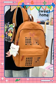 Large capacity student backpack casual orange school bag with cute bear pendant for travel.